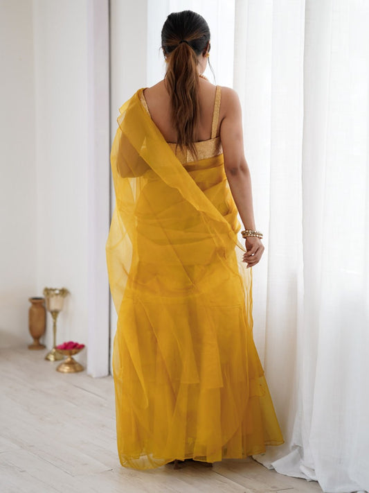 Women's mustard yellow organza saree with ruffle detailing