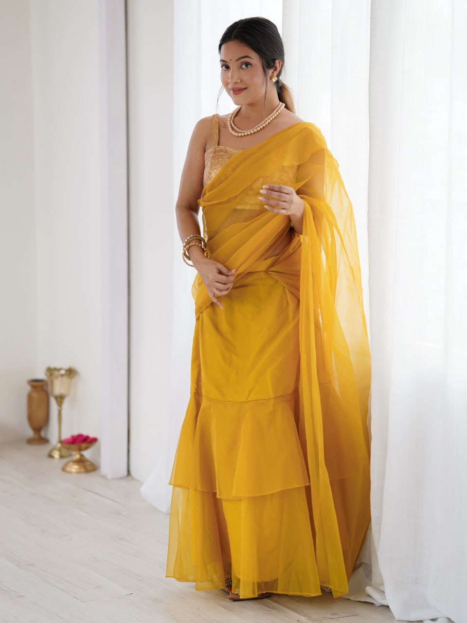 Mustard yellow embellished ruffle saree for festive wear