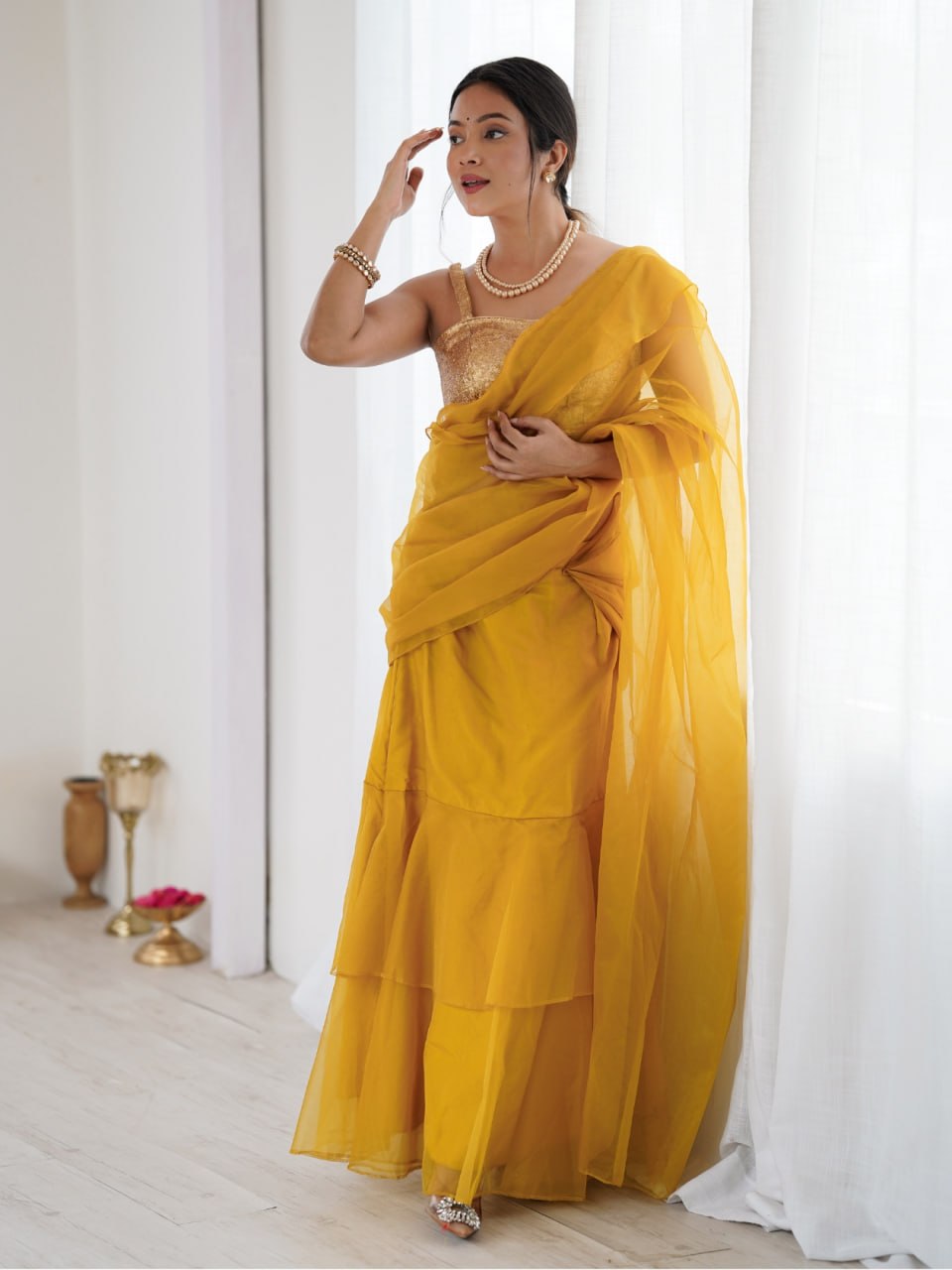 Mustard ruffle saree with sequined belt and blouse piece